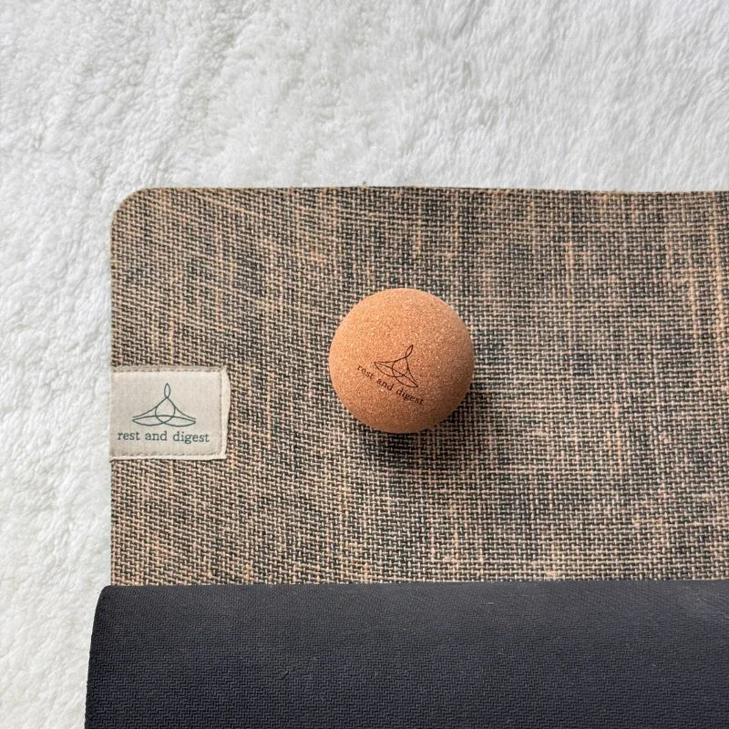 Rest and Digest cork massage ball with natural rubber and jute yoga mat