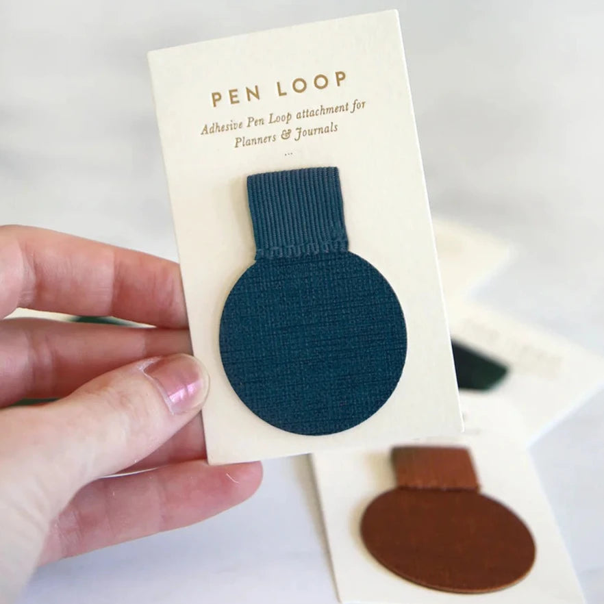 navy pen loop in hand