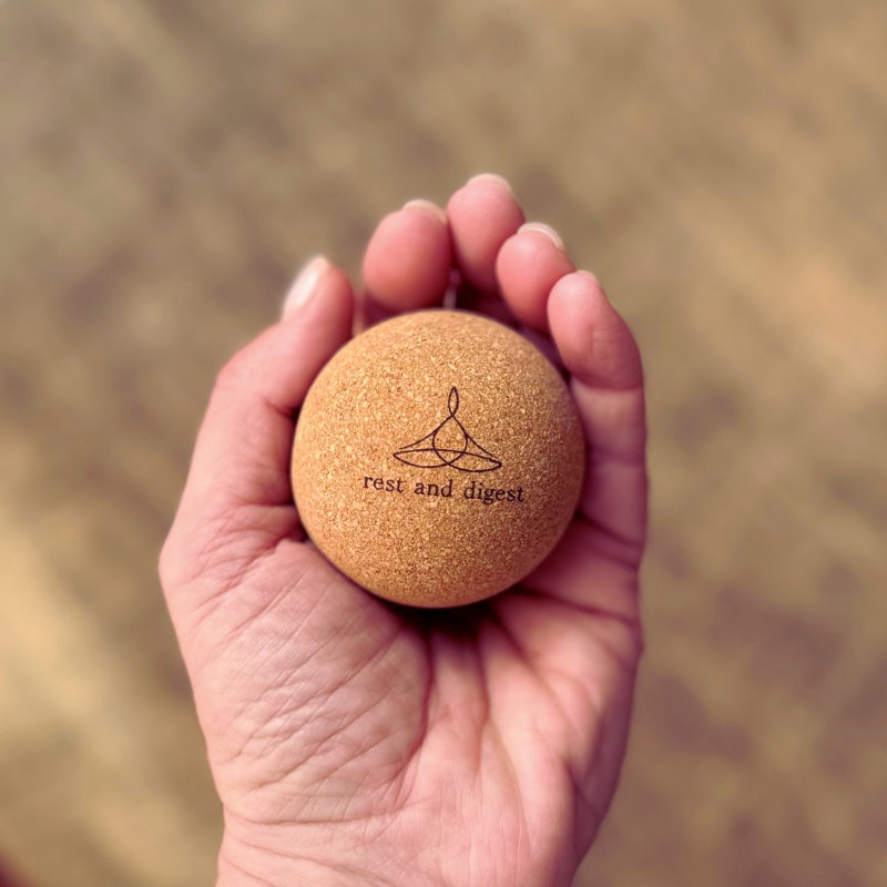 Rest and Digest cork massage ball held in hand