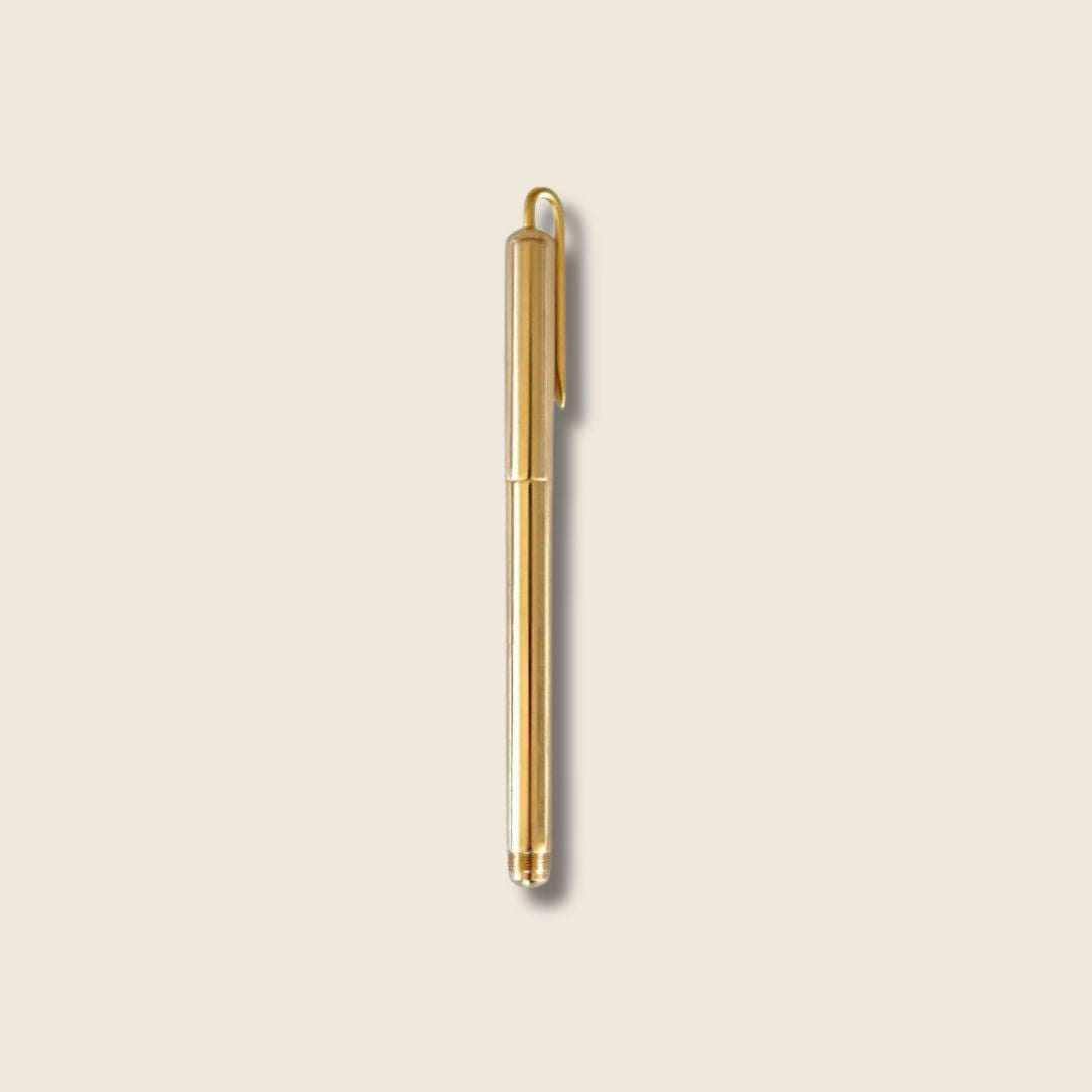 image of round brass pen