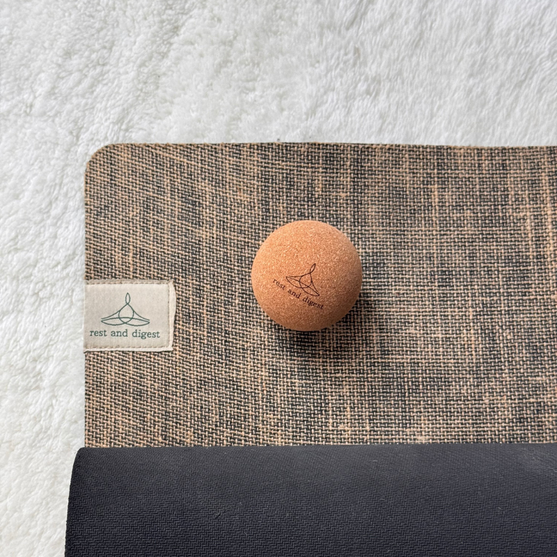 Rest and Digest cork massage ball with natural rubber and jute yoga mat
